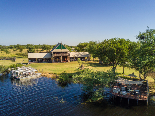 Picture of main buildings and viewing boat at Chobe River Camp Accommodation at Caprivi in Namibia