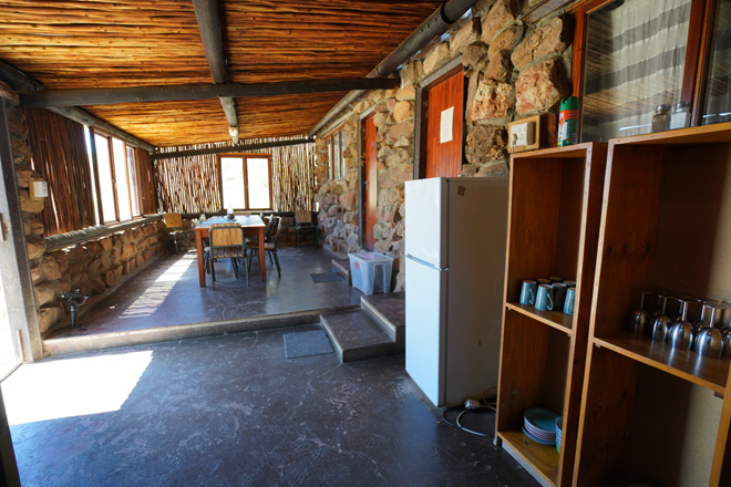 Photo of kitchen and dining area at Ghost Canyon Cabin Accommodation in Aus Namibia