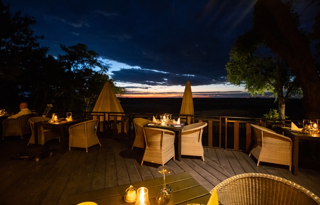 Picture showing dining area at night at Namushasha River Lodge in Caprivi Namibia