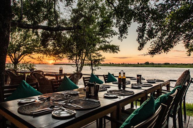 Picture of dining area on the deck at Zambezi Mubala Lodge Accommodation in Caprivi Namibia