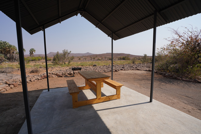 Picnic Table in the shade of one of the campsites at Palmwag Camping