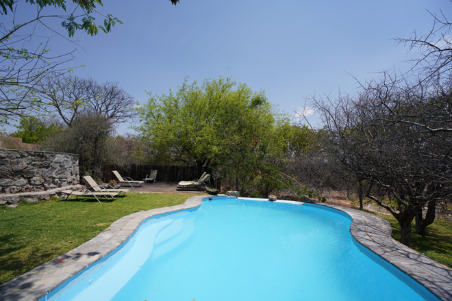 Sparkling swimming pool at Toshari Lodge just outside Etosha National Park Namibia.